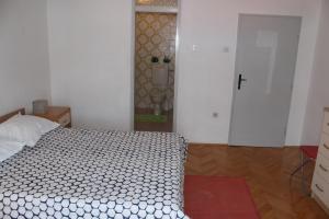 Rúm í herbergi á Guesthouse Marta