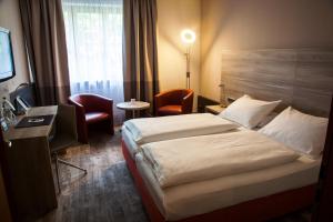 Postel nebo postele na pokoji v ubytování Hotel Kastanienhof