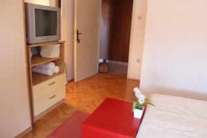 Rúm í herbergi á Guesthouse Marta