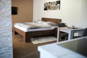 Postel nebo postele na pokoji v ubytování Penzion Sokolská