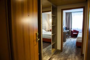Postel nebo postele na pokoji v ubytování Hotel Kastanienhof