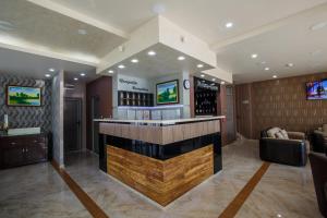 a bar in a wine tasting room with a counter at Hotel Morava - Šabac in Šabac