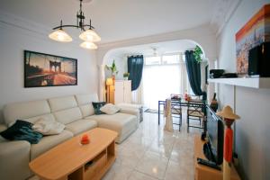a living room with a couch and a table at Costa del Silencio Apartment in Costa Del Silencio