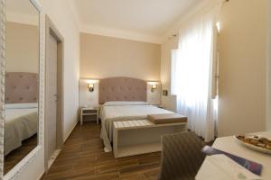 Postel nebo postele na pokoji v ubytování Albergo Battelli Only Adults