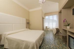 Postel nebo postele na pokoji v ubytování Albergo Battelli Only Adults