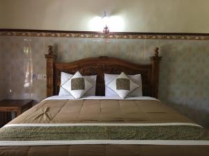 Кровать или кровати в номере Eka's Homestay