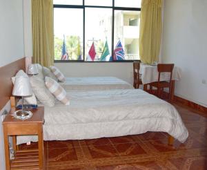 Cama o camas de una habitación en Casa del Huesped - Guest House