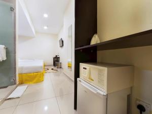 Kuchyň nebo kuchyňský kout v ubytování One Avenue Hotel