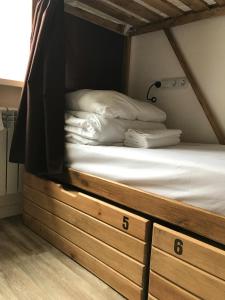 Кровать или кровати в номере Hostel 65