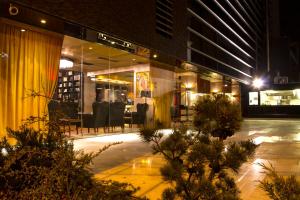 a store front of a building at night at Ganzo Boutique Hotel in Bucharest