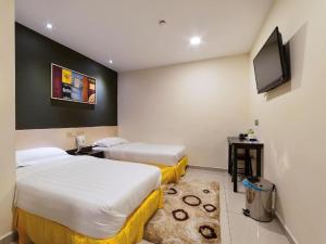 TV a/nebo společenská místnost v ubytování One Avenue Hotel
