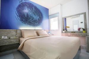 Letto o letti in una camera di De Green Inn @aeropolis