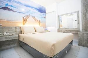 Letto o letti in una camera di De Green Inn @aeropolis