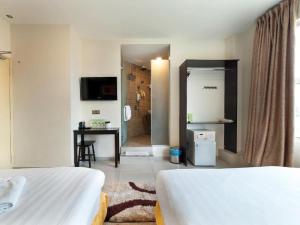 Postel nebo postele na pokoji v ubytování One Avenue Hotel + 37 fotografií