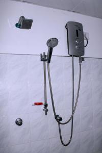a shower in a bathroom with a shower head at Elliot Nature Resort in Galle