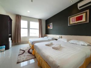 Postel nebo postele na pokoji v ubytování One Avenue Hotel
