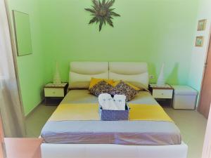 Postel nebo postele na pokoji v ubytování B&B Gi & Giò