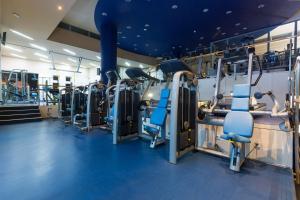 a gym with treadmills and cardio machines at Valamar Diamant Hotel in Poreč