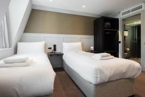 Cama ou camas em um quarto em Mowbray Court Hotel