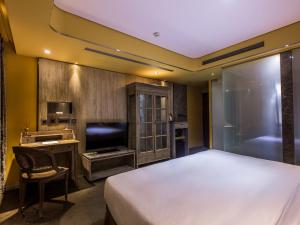Voodi või voodid majutusasutuse inhouse Hotel toas