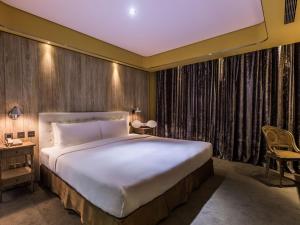 Voodi või voodid majutusasutuse inhouse Hotel toas