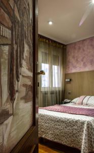 Katil atau katil-katil dalam bilik di Hostal Goya Suites
