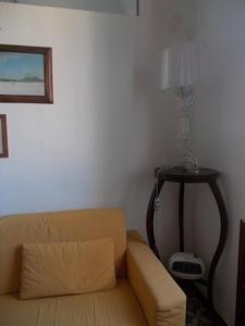 a living room with a couch and a table at Casa Montagnese in Anacapri