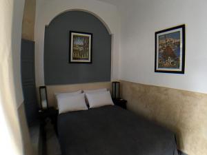 Postel nebo postele na pokoji v ubytování Riad Bel Haj
