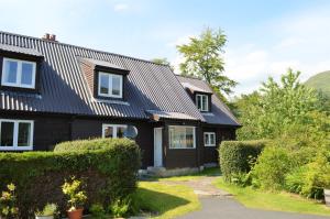 a black house with a metal roof at The Ranch Lodge in Benmore