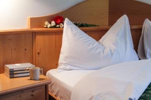 Postel nebo postele na pokoji v ubytování Hotel Alpi