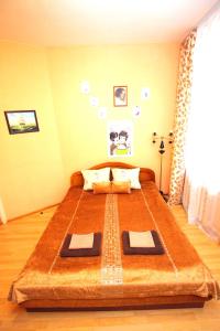 a bedroom with a large bed in a room at MANGO SPb in Saint Petersburg