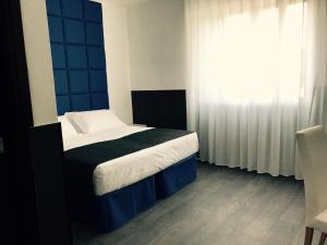 Postel nebo postele na pokoji v ubytování Hotel Pex Padova