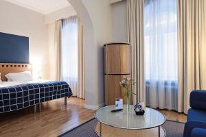 Ένα ή περισσότερα κρεβάτια σε δωμάτιο στο Elite Stadshotellet Växjö