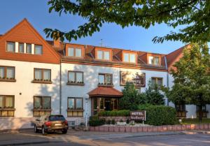 a truck parked in front of a hotel at Hotel Stolberg in Wiesbaden