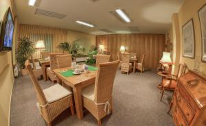 a dining room with a table and chairs at Hotel Stolberg in Wiesbaden