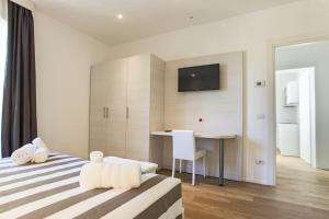 Postel nebo postele na pokoji v ubytování Hotel Houston Suites