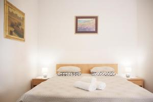 Rúm í herbergi á Guesthouse Marta