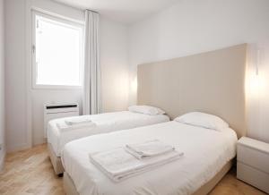 Krevet ili kreveti u jedinici u okviru objekta City Stays Sé Apartments