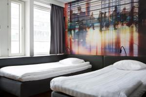 Voodi või voodid majutusasutuse Comfort Hotel Xpress Stockholm Central toas