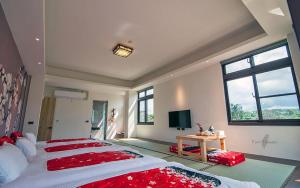 Rúm í herbergi á Yulaikung B&B