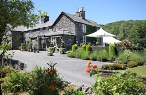 a building with a parking lot in front of it at Aberdunant Hall in Porthmadog