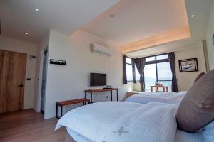 Sjónvarps- og/eða afþreyingartæki á Yulaikung B&B