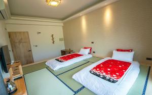 Rúm í herbergi á Yulaikung B&B