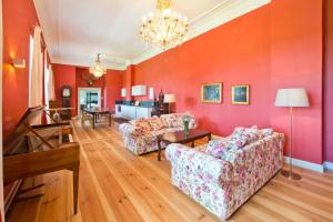 a living room with two couches and a table at Schloss Retzow Apartments in Retzow