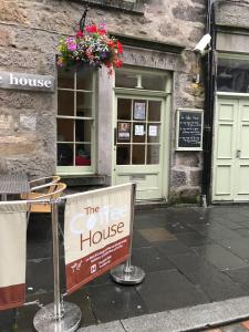 a free house sign in front of a building at The Coffee House Hotel in Aberdeen