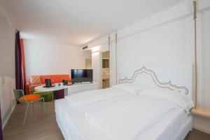 Postel nebo postele na pokoji v ubytování Holiday IV Gardan