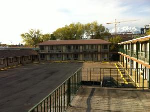 an empty parking lot in front of a building at Provo Inn & Suites in Provo