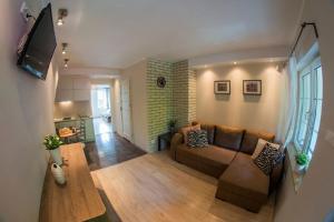 TV a/nebo společenská místnost v ubytování Impresja