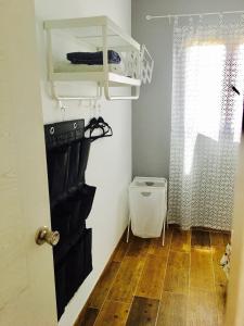 a small room with a bunk bed and a wooden floor at Casa Campillo, Habitaciones Individuales in Telde