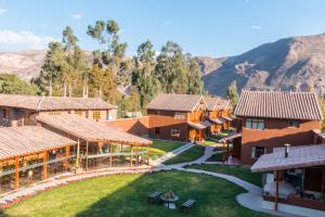 an aerial view of a resort with mountains in the background at Wayqey Lodge in Urubamba